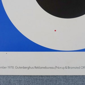 May include: A vintage poster with a geometric design featuring a red, black, and blue color scheme. The poster text reads "Energi-Spareudvalg. September 1978. Gutenberghus Reklamebureau/Norup & Bramsted Offset, K&oslash;benhavn."