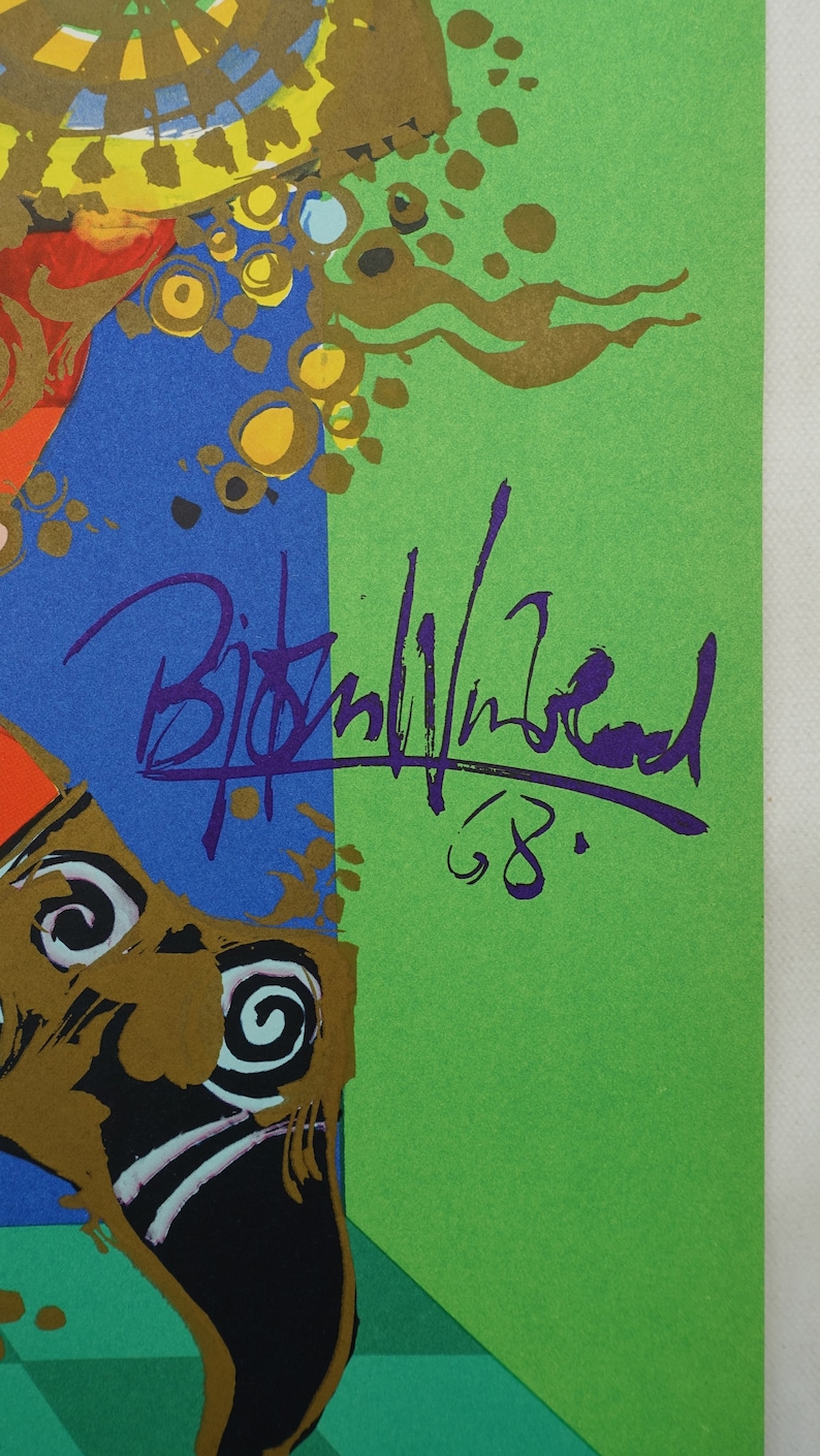May include: Abstract art print with a signature in purple ink and the number '68'. The artwork features blue, green, gold, and orange colours. The signature appears to be the artist's name.