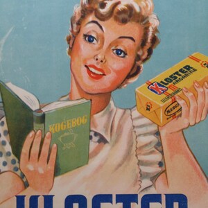 May include: A vintage advertisement for Kloster Margarine featuring a woman holding a cookbook and a stick of margarine. The text on the margarine reads "Kloster Margarine" and the text on the cookbook reads "Kogebog". The advertisement also includes the text "'man tager...'".