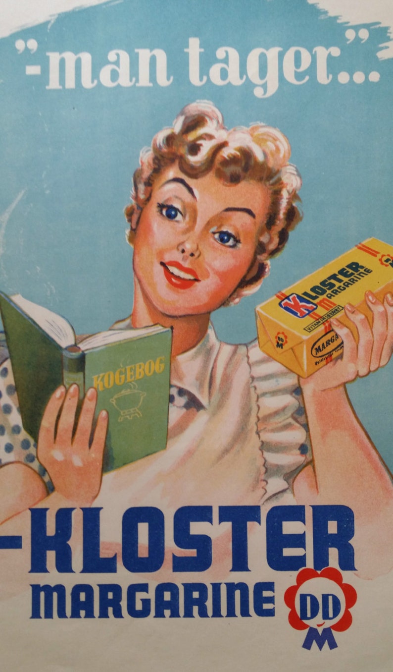 May include: A vintage advertisement for Kloster Margarine featuring a woman holding a cookbook and a stick of margarine. The text on the margarine reads "Kloster Margarine" and the text on the cookbook reads "Kogebog". The advertisement also includes the text "'man tager...'".