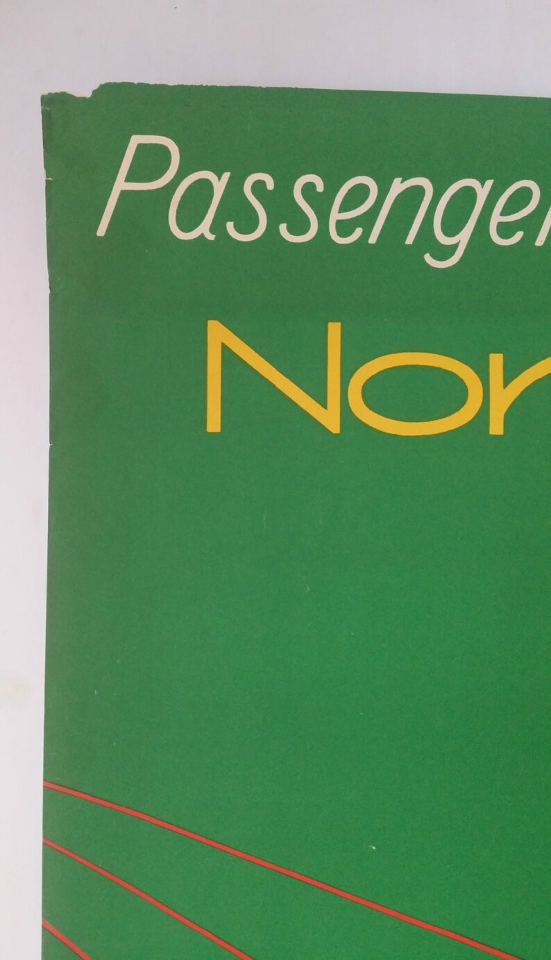 May include: A green poster with the text "Passenger" in white and "Nor" in yellow.
