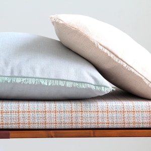 Rustic cream and sky blue fringed linen blend pillow covers by Linenspace