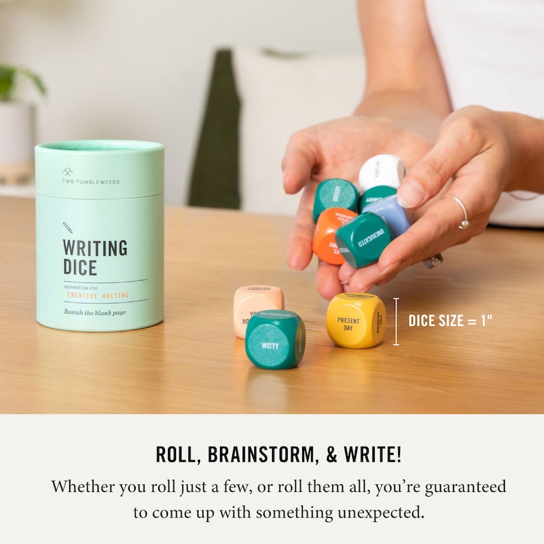 May include: A set of six colorful dice with words printed on each side. The dice are 1 inch in size and are packaged in a green tube with the words "Writing Dice" printed on it. The dice are designed to inspire creative writing.
