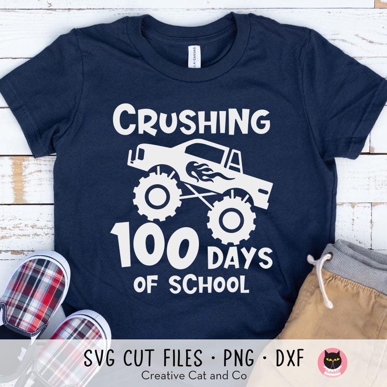 May include: A blue t-shirt with a white graphic of a monster truck and the text "Crushing 100 Days of School".