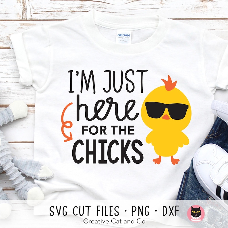 May include: White t-shirt with a black graphic that says "I'm just here for the chicks" and a cartoon yellow chick wearing sunglasses.
