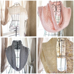 May include: Four crocheted scarves displayed on mannequins. The scarves are in white, pink, gray, and beige.