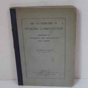 May include: A vintage book, "Key to Exercises in Spanish Composition", with a faded green cover and a dark blue spine. The text is in black. The author's name and the book's title are visible.