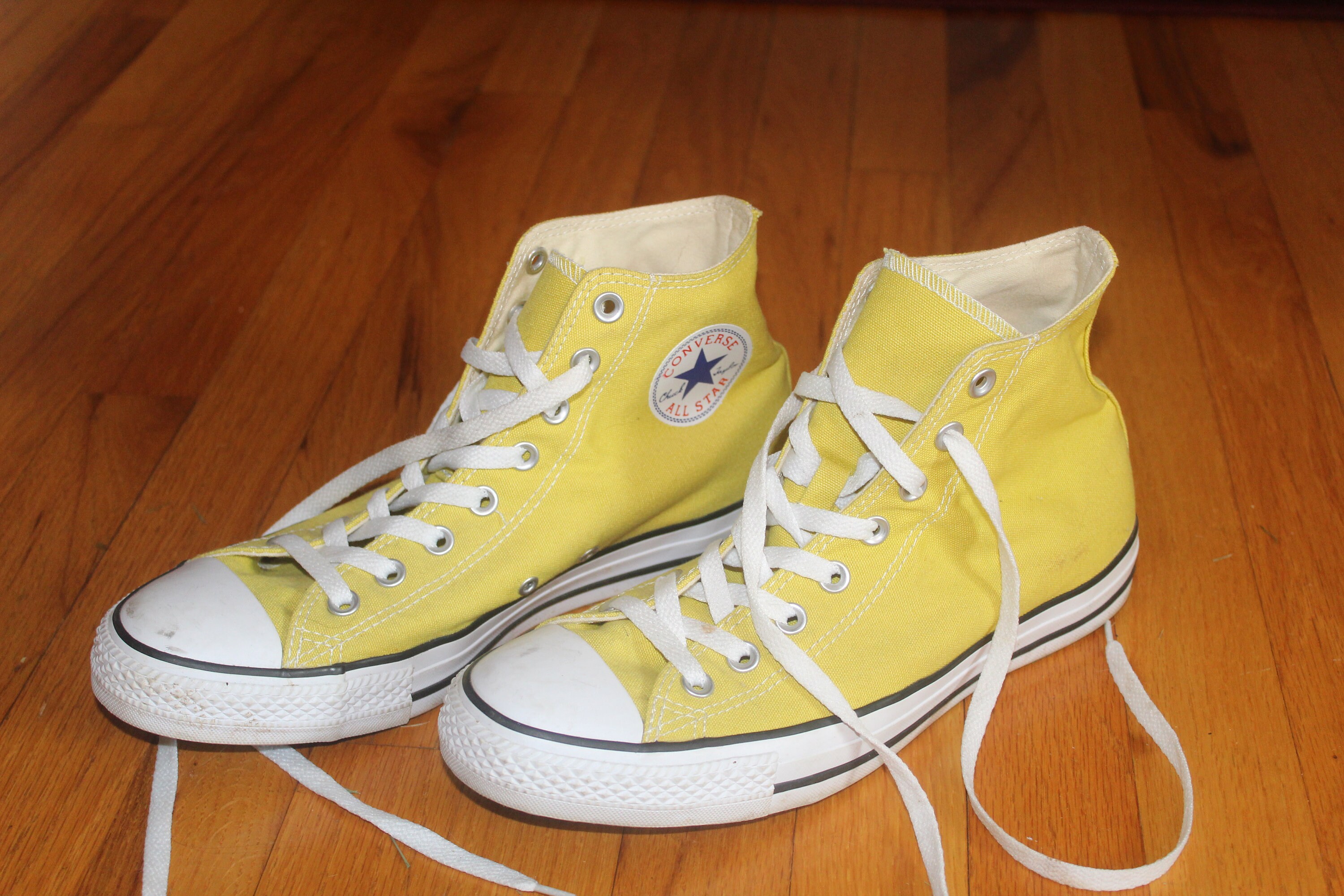 yellow chuck taylors high tops