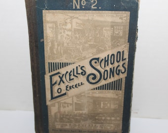 May include: An antique book titled "Excell's School Songs" with a blue and beige cover. The cover features illustrations of a schoolroom and text including "No. 2" and the author's name, O. Excell. The book's spine is dark blue.