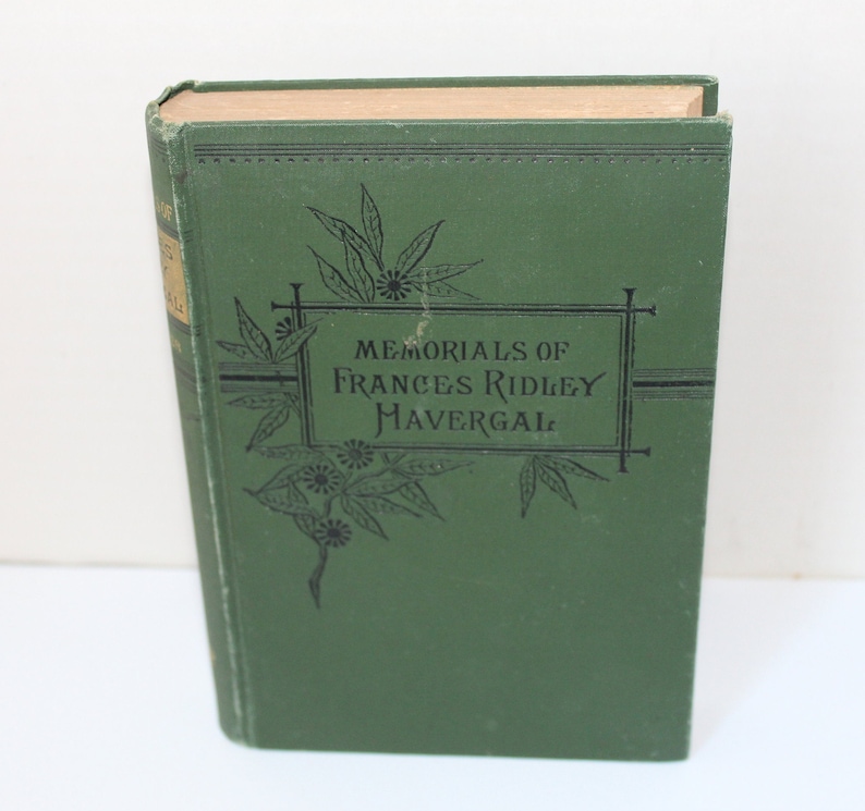 May include: A green hardcover book with the title "Memorials of Frances Ridley Havergal" printed in black lettering on the front cover.