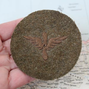 May include: A set of three ceramic mugs with a speckled, matte finish. The mugs are in shades of cream, light gray, and dark gray. Each mug has a simple, minimalist design and a rounded handle. Perfect for coffee or tea.