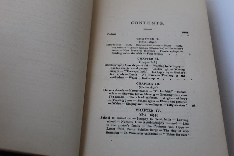 May include: A black and white book with the title "CONTENTS" printed on the cover. The book is open to a page with a table of contents listing chapters and their corresponding page numbers. The chapters are titled "Introduction", "Autobiography from six years old", "The new decade", and "School at D&uuml;sseldorf".