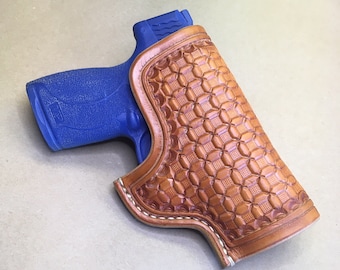 The "Classic" Holster for a S&W MP 45 Shield..... Traditional OWB Style..... Saddle Leather.....Handtooled..... Handstitched.