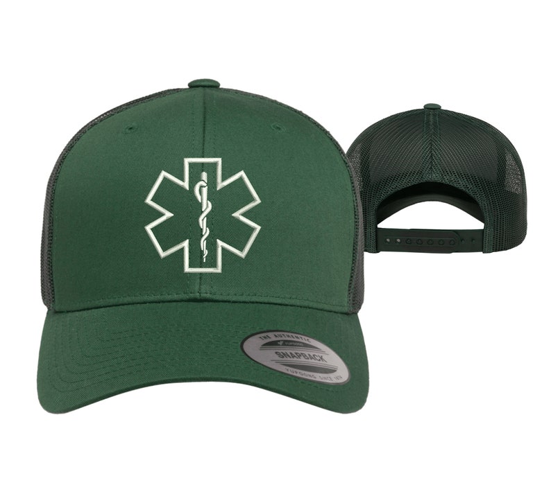May include: A green and black trucker hat with a white embroidered medical symbol, the Star of Life, on the front. The hat has a mesh back and a snap closure.