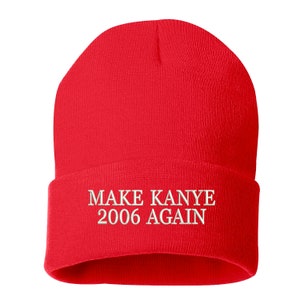 May include: Red knit beanie with white embroidered text that reads "MAKE KANYE 2006 AGAIN".