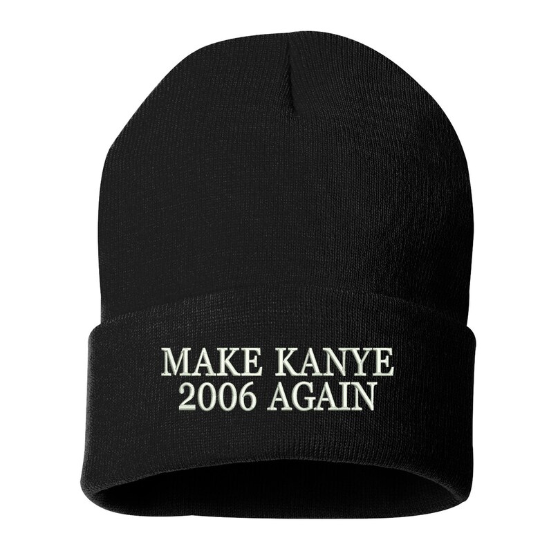 May include: Black knit beanie with white embroidered text that reads "MAKE KANYE 2006 AGAIN".