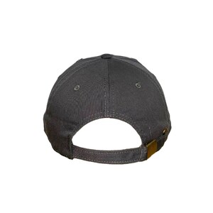 May include: A gray baseball cap with a curved brim and an adjustable strap in the back.