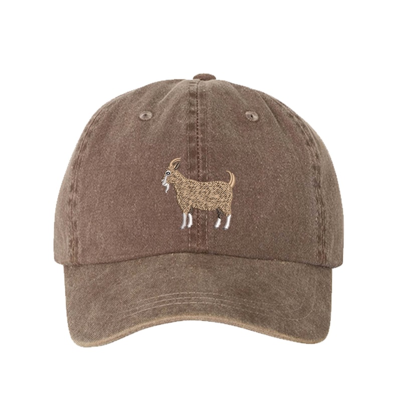 May include: A brown baseball cap with a brown embroidered goat on the front.