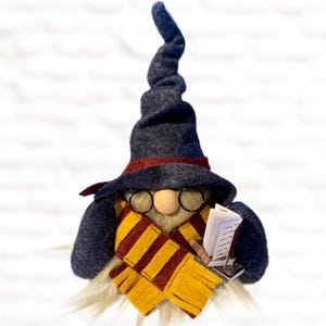 May include: A set of three ceramic mugs with a speckled, matte finish. The mugs are in shades of cream, light gray, and dark gray. Each mug has a simple, modern design and a rounded handle.