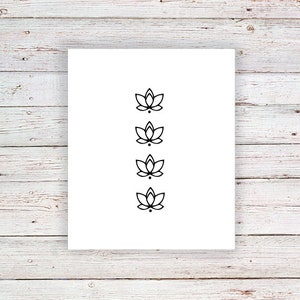 May include: A white sheet of paper with four black lotus flower designs in a vertical row.