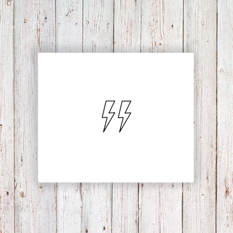 May include: A white card with two black lightning bolt symbols.