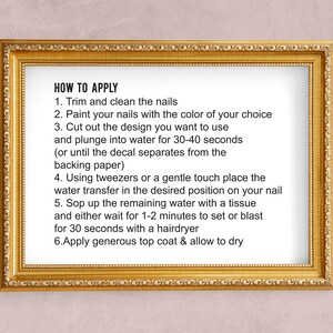 May include: A framed instruction sheet with the title "HOW TO APPLY" and six steps for applying nail decals. The steps include trimming and cleaning nails, painting nails, cutting out the design, plunging the design into water, placing the design on the nail, and applying a top coat.