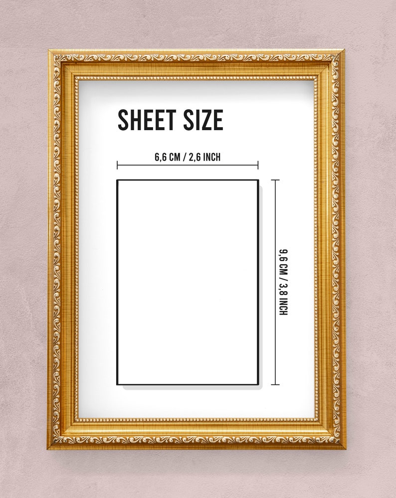 May include: A gold-colored frame with a white mat and black text that reads "SHEET SIZE" and "6.6 CM / 2.6 INCH" and "9.6 CM / 3.8 INCH". The frame is on a light pink background.