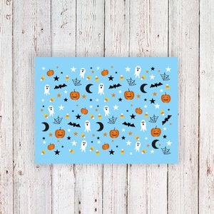 May include: A light blue background with a repeating pattern of Halloween icons. The icons include pumpkins, ghosts, bats, stars, and candy corn.