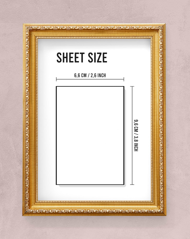 May include: A gold-coloured frame with a white mount and black text that reads "SHEET SIZE" and "6.6 CM / 2.6 INCH" and "9.6 CM / 3.8 INCH". The frame is on a light pink background.