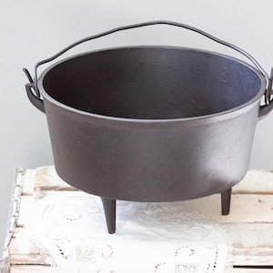 Antique 12" cast iron dutch oven with gate mark, manufactured in the 1800's, has molders initials on it, WN".