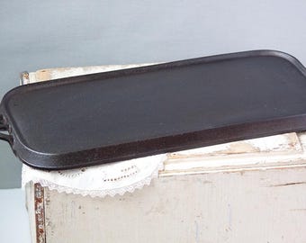 Unmarked Lodge #7, 8-1/2 X 18-1/2" cast iron griddle in excellent condition manufactured from 1960- 1980's