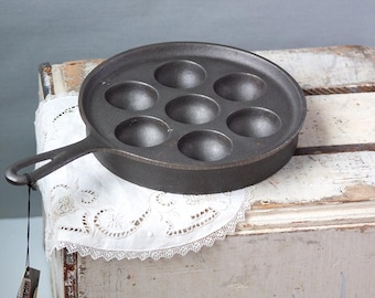 Aebelskiver cast iron pan manufactured by Lodge, never been used or seasoned.