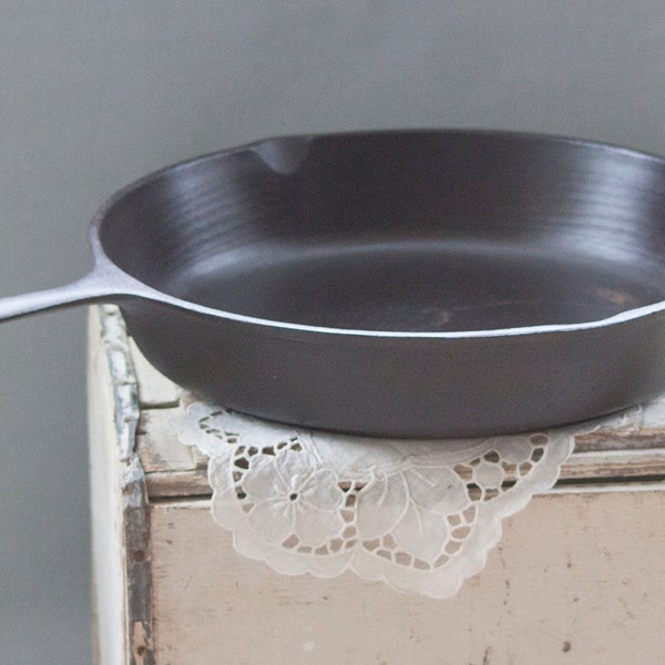 Large Lodge #12, 13-1/4" cast iron skillet manufactured in the 1940's-1950's.