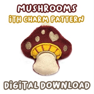 以下が含まれることがあります： バーガンディ色のキノコチャーム。金色のアクセントとクリーム色の茎があります。「MUSHROOMS ITH CHARM PATTERN DIGITAL DOWNLOAD」の文字。チャームは柔らかく、ぬいぐるみのような質感です。紫色の水玉模様の白い背景に配置されています。