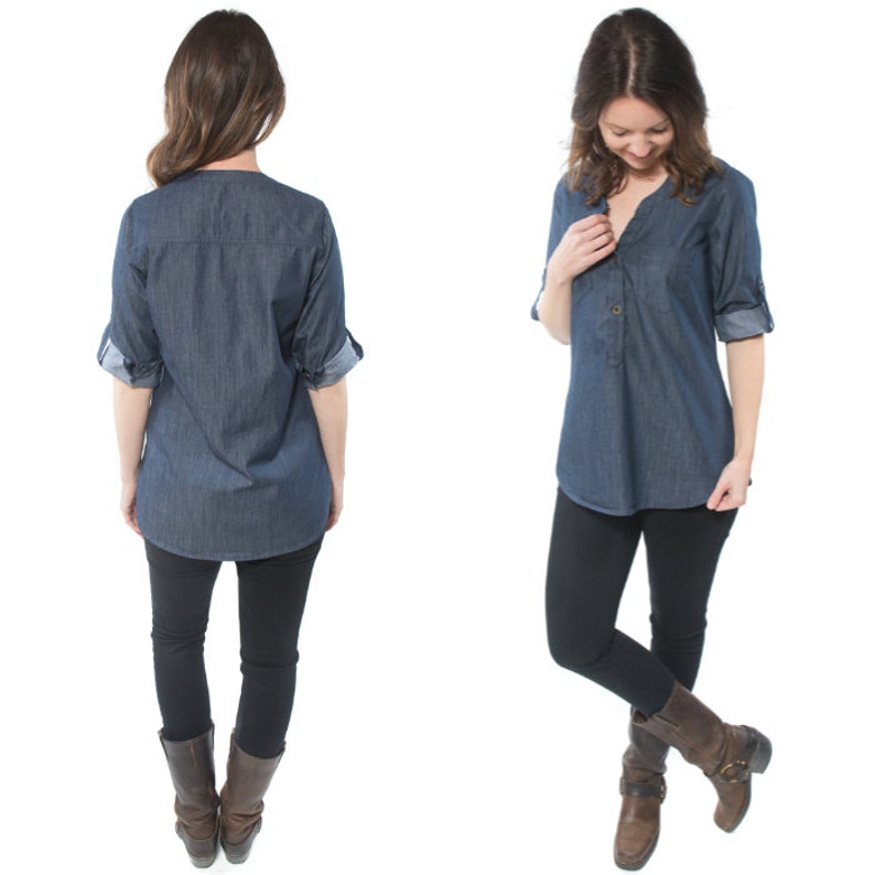 May include: A denim shirt with a button-down collar and rolled-up sleeves. The shirt is a dark blue color and has a relaxed fit. The model is wearing black leggings and brown boots.