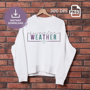 May include: White sweatshirt with the text "sweater weather" in purple and green lettering with a small heart.