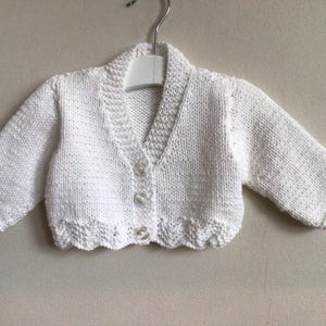 Luxury hand knitted white cardigan for a newborn baby, age 0-3 months, perfect new baby gift