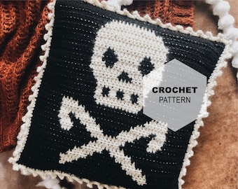 May include: A square, black and white crochet pillow featuring a skull and crossbones design. The skull is white, with black eye sockets and a nose. The crossbones are also white. The pillow has a scalloped white border and the text "CROCHET PATTERN".