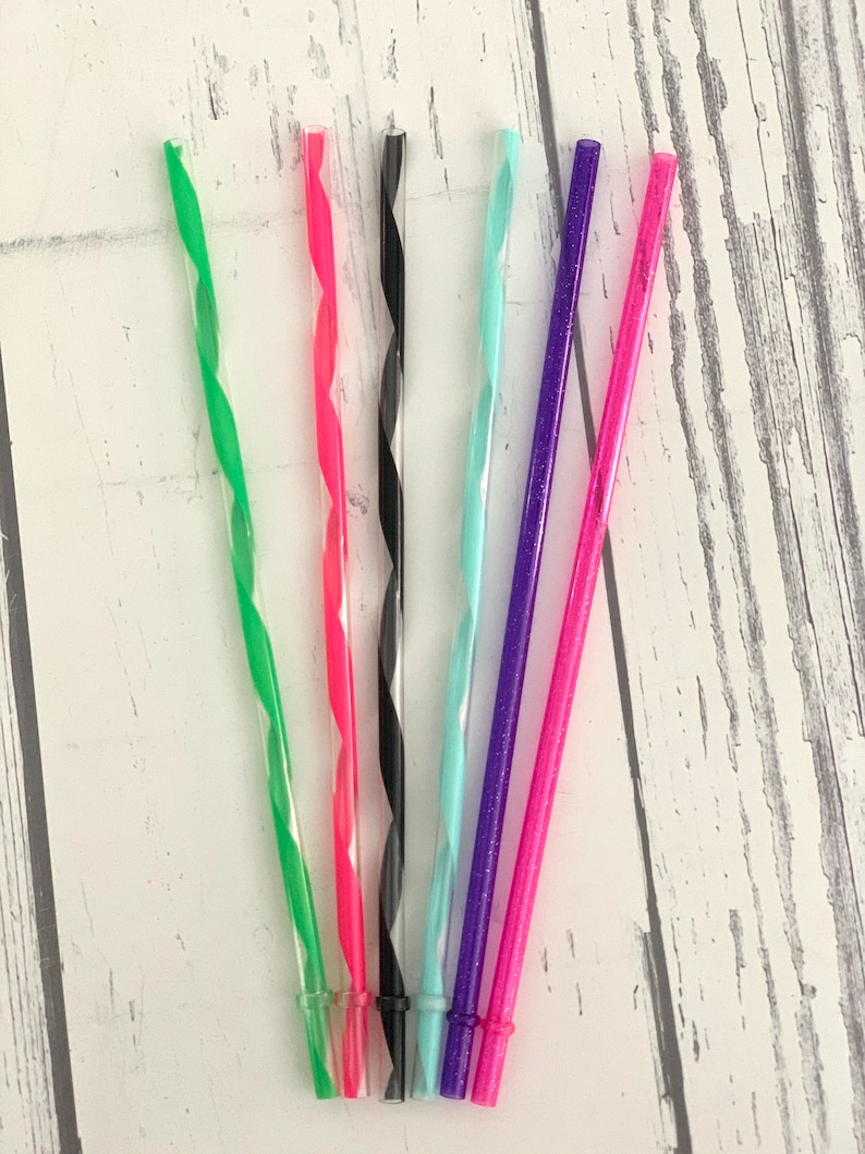 May include: A collection of six colorful, reusable plastic drinking straws. The straws are green, pink, black, light blue, purple, and pink. Each straw has a spiral design and is approximately 9 inches long.