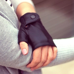 Trendy and modern women leather gloves without fingers, fingerless mittens, soft nappa leather