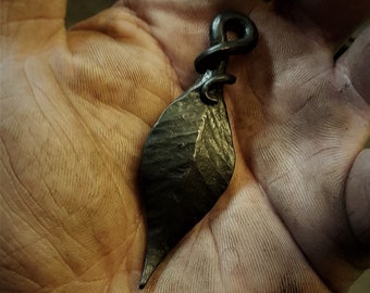 A hand forged Leaf pendant . Comes supplied with a high quality elk leather thread.