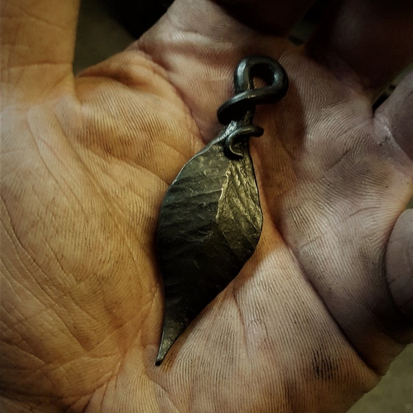 A hand forged Leaf pendant . Comes supplied with a high quality elk leather thread.