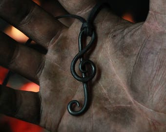 A hand forged Clef pendant . Comes supplied with a high quality elk leather thread.