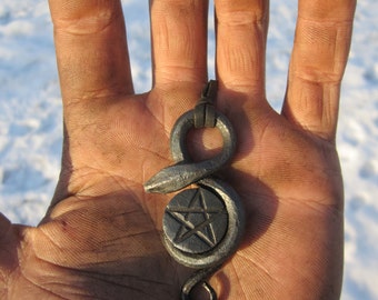 A hand forged serpent pendant with a pentagram in the middle. Comes supplied with a high quality elk leather thread.