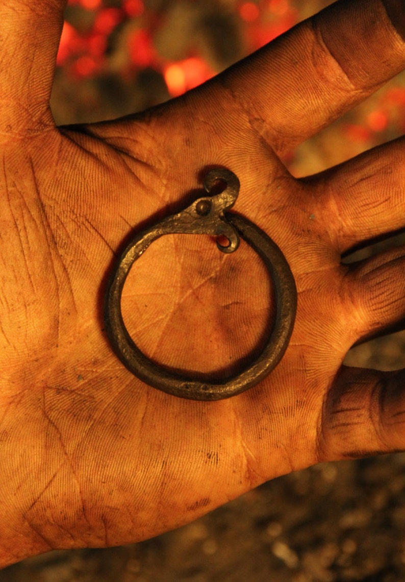 A hand forged Ouroboros/ Midgård/World serpent pendant . Comes supplied with a high quality elk leather thread. image 1