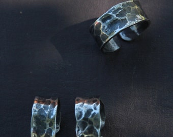 Hand forged stainless steel ring with a ball peen hammer texture