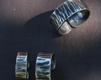 Hand forged stainless steel ring with a cross peen hammer marks