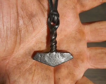 A hand forged Thors hammer Mjölnir with a twisted handle. Comes with a high quality elk leather thread. Price includes postage fees.