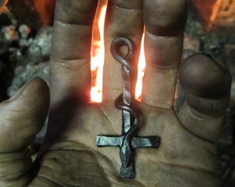 A hand forged inverted Cross & serpent pendant . Comes supplied with a high quality elk leather thread.