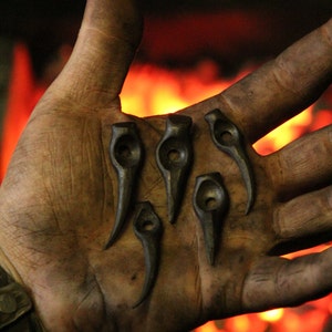 Hand forged  Wolf/Bear tooth pendant. Comes supplied with a high quality elk leather thread.